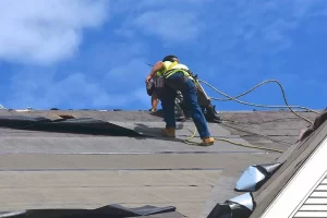 Roof repair services in Ridgewood, NJ, featuring skilled technicians repairing a residential roof.